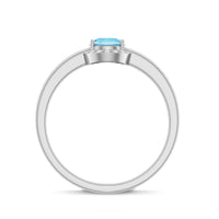 Certified real aquamarine promise ring with diamond halo by Rosec Jewels, featuring a blue aquamarine center stone and sparkling diamonds.
