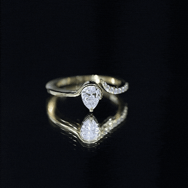 Yellow pear-shaped moissanite cuff ring for women by Rosec Jewels, featuring a unique design and sparkling gemstone centerpiece.