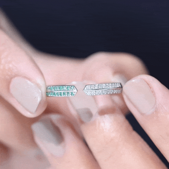 Contemporary emerald and diamond open wedding band ring by Rosec Jewels featuring green emeralds and sparkling diamonds.