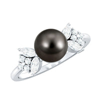 Nature-inspired Tahitian pearl engagement ring with diamond set in rose gold, featuring intricate design and elegant craftsmanship.