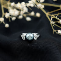 Nature-inspired Tahitian pearl engagement ring with diamond accents, featuring elegant Rosec Jewels craftsmanship.