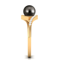 Solitaire Tahitian pearl bypass engagement ring with diamond accents by Rosec Jewels, featuring a prominent black pearl and elegant band.