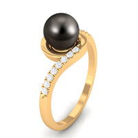 Solitaire Tahitian pearl bypass engagement ring with diamond from Rosec Jewels, featuring a lustrous black pearl and sparkling center stone.