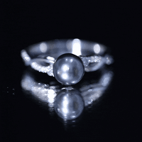 Tahitian pearl and diamond crossover engagement ring by Rosec Jewels featuring yellow gold band and intricate design details.