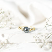 Tahitian pearl and diamond crossover engagement ring by Rosec Jewels featuring elegant design and sparkling gemstones.