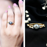 Tahitian pearl and diamond crossover engagement ring by Rosec Jewels featuring a lustrous pearl and sparkling diamonds in a sleek design.