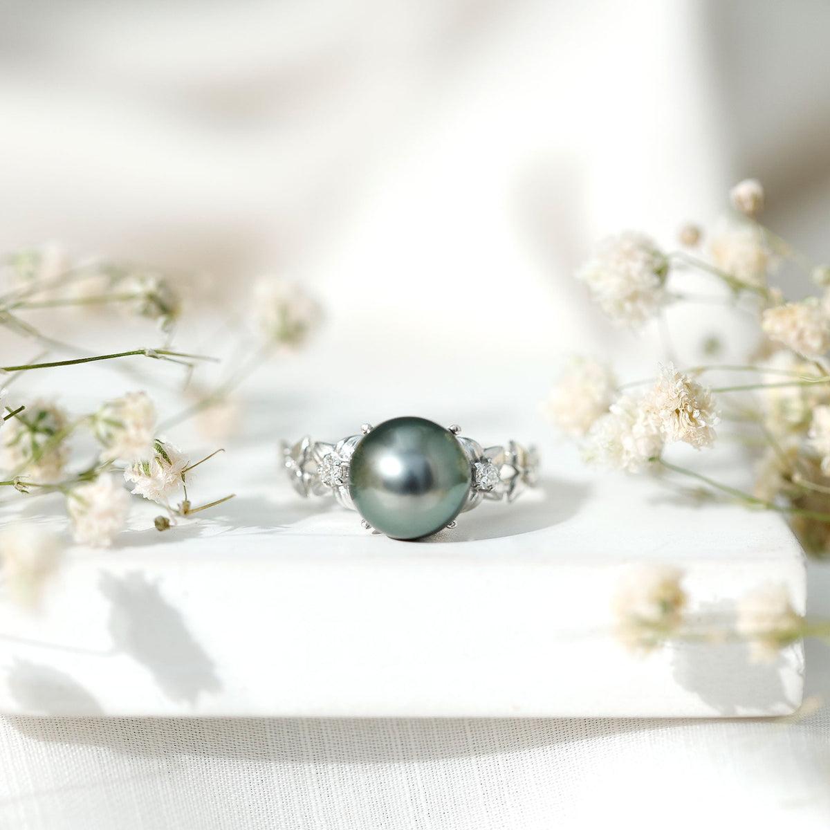 7.5 carat genuine Tahitian black pearl flower engagement ring with sparkling diamonds, crafted by Rosec Jewels.