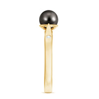 Black Tahitian pearl solitaire engagement ring with certificate, featuring a polished band and a prominent dark pearl centerpiece.