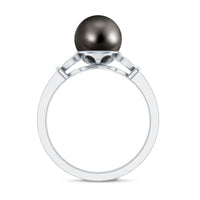 Tahitian pearl and diamond engagement ring with split shank from Rosec Jewels, featuring a central dark pearl and sparkling diamonds.