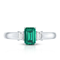 Emerald cut emerald and diamond 3-stone promise ring for her, featuring sparkling gemstones set in a delicate rose gold band.
