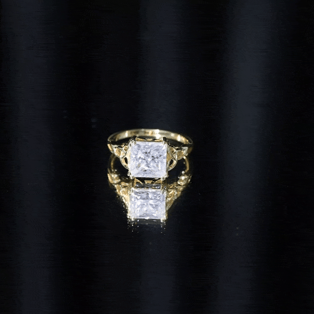 Yellow gold moissanite princess cut engagement ring with Celtic knot design from Rosec Jewels.