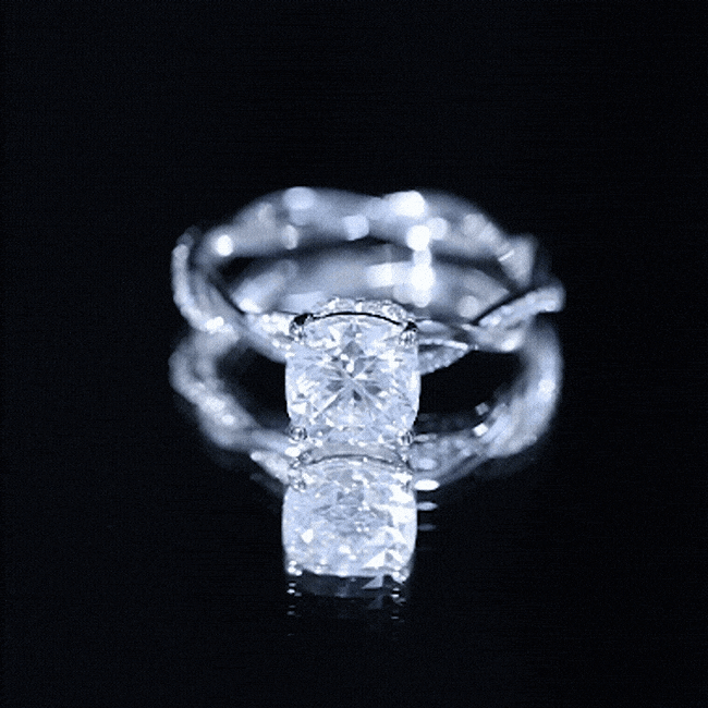 Yellow gold cushion cut moissanite engagement ring with hidden halo, featuring a 3-carat center stone and intricate band details.