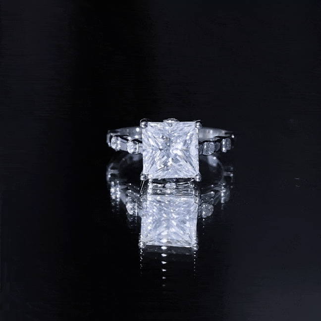Princess cut moissanite solitaire engagement ring with spaced accent settings, crafted by Rosec Jewels.