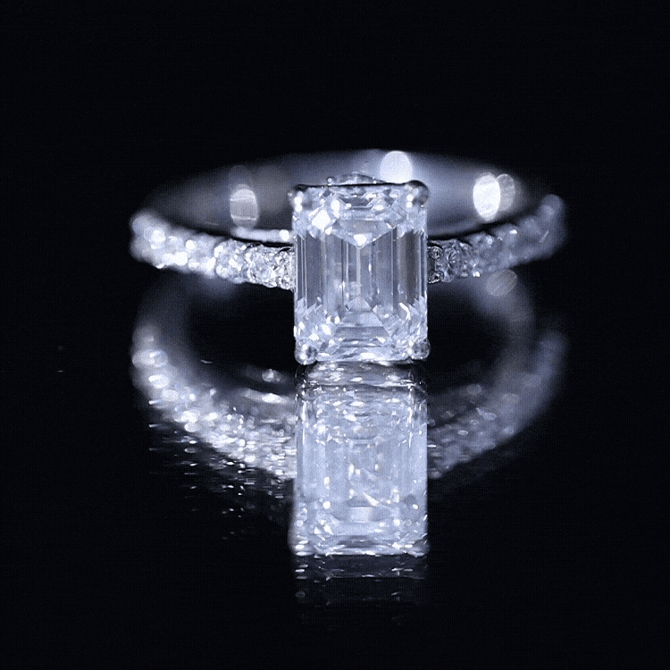 Yellow gold moissanite engagement ring with emerald cut center stone and hidden halo by Rosec Jewels.