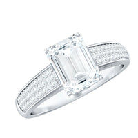 Emerald cut moissanite side stone engagement ring by Rosec Jewels showcasing a platinum band with sparkling emerald cut stones.