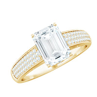 Emerald cut moissanite side stone engagement ring by Rosec Jewels featuring a sleek band and sparkling center gemstone.