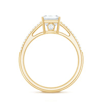 Emerald cut moissanite side stone engagement ring with a central gem and additional stones on a silver band, crafted by Rosec Jewels.