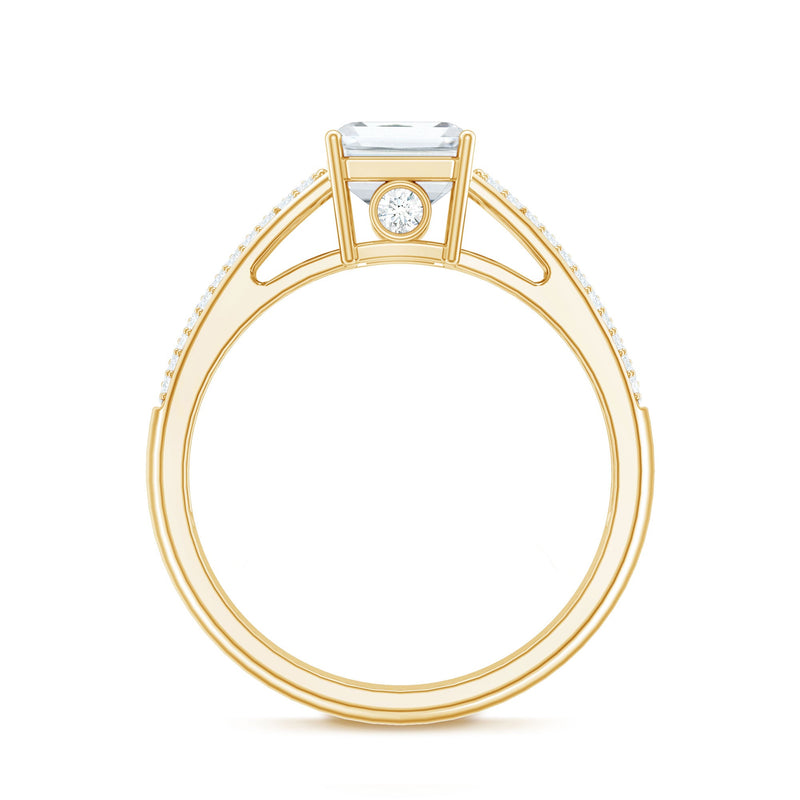 Emerald cut moissanite side stone engagement ring with a central gem and additional stones on a silver band, crafted by Rosec Jewels.