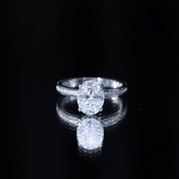 2 Carat Solitaire Moissanite Oval Engagement Ring with Channel Set Side Stones