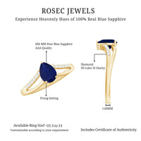 Pear cut blue sapphire solitaire ring with split shank design and diamond accents by Rosec Jewels.