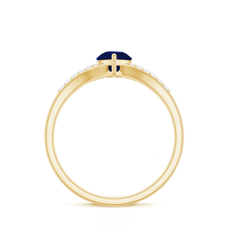 Pear cut blue sapphire solitaire ring with diamond accents and split shank design by Rosec Jewels, showcasing elegant jewelry craftsmanship.