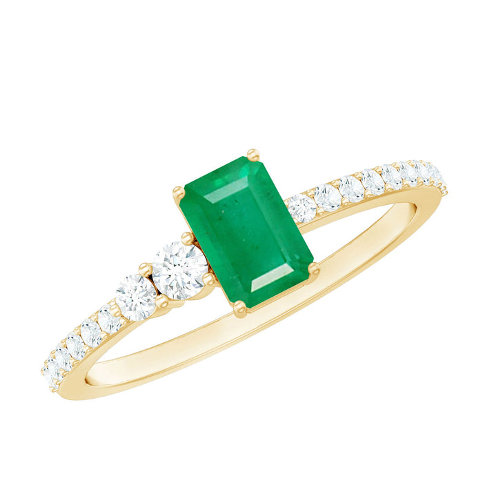 Natural emerald cut emerald engagement ring with diamond side stones from Rosec Jewels, showcasing a elegant center gemstone and sparkling accents.
