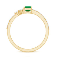 Natural emerald cut emerald engagement ring with diamond side stones, featuring a sleek gold band from Rosec Jewels.