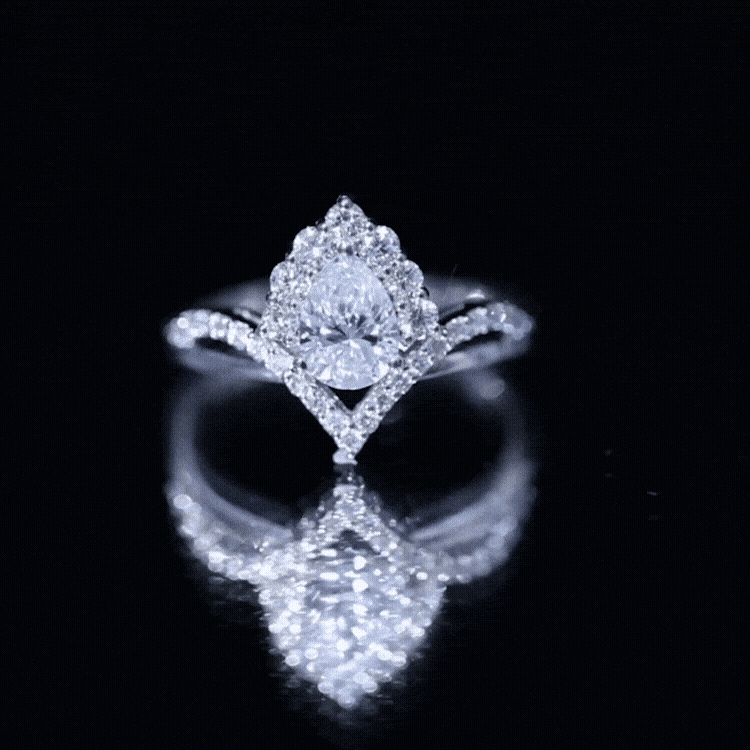Women's pear-shaped moissanite engagement ring in silver featuring a sparkling solitaire stone, designed by Rosec Jewels.