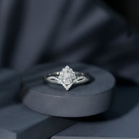 Pear-shaped moissanite engagement ring with 0.79 carats set in a rose gold band by Rosec Jewels.
