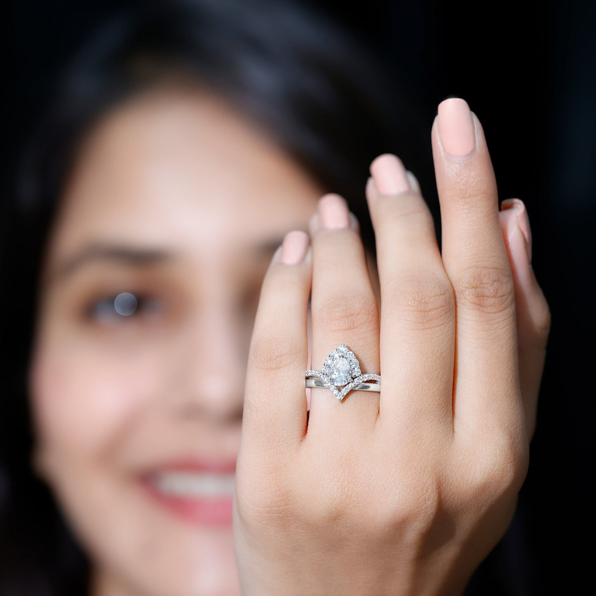 Pear-shaped 0.79 carat moissanite engagement ring by Rosec Jewels, featuring a sparkling center gemstone and elegant band.