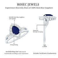 Pear cut blue sapphire solitaire ring with diamond accents from Rosec Jewels, showcasing a elegant blue gemstone and fine metal setting.