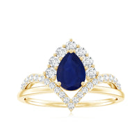 Pear cut blue sapphire solitaire ring with diamond accent, featuring elegant design by Rosec Jewels.