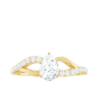 Certified pear cut moissanite split shank engagement ring with intricate band design, showcasing a sparkling central stone.