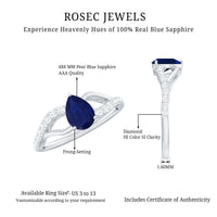 Pear-shaped blue sapphire engagement ring with split shank design and certification by Rosec Jewels, showcasing the gemstone and ring setting.