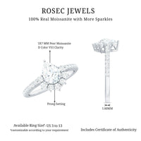 Moissanite teardrop engagement ring with half halo featuring a sparkling center stone and intricate band design.