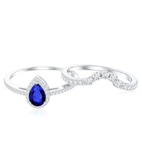 Pear-shaped blue sapphire and diamond engagement ring set by Rosec Jewels featuring a certified lab-grown blue sapphire and sparkling diamonds.