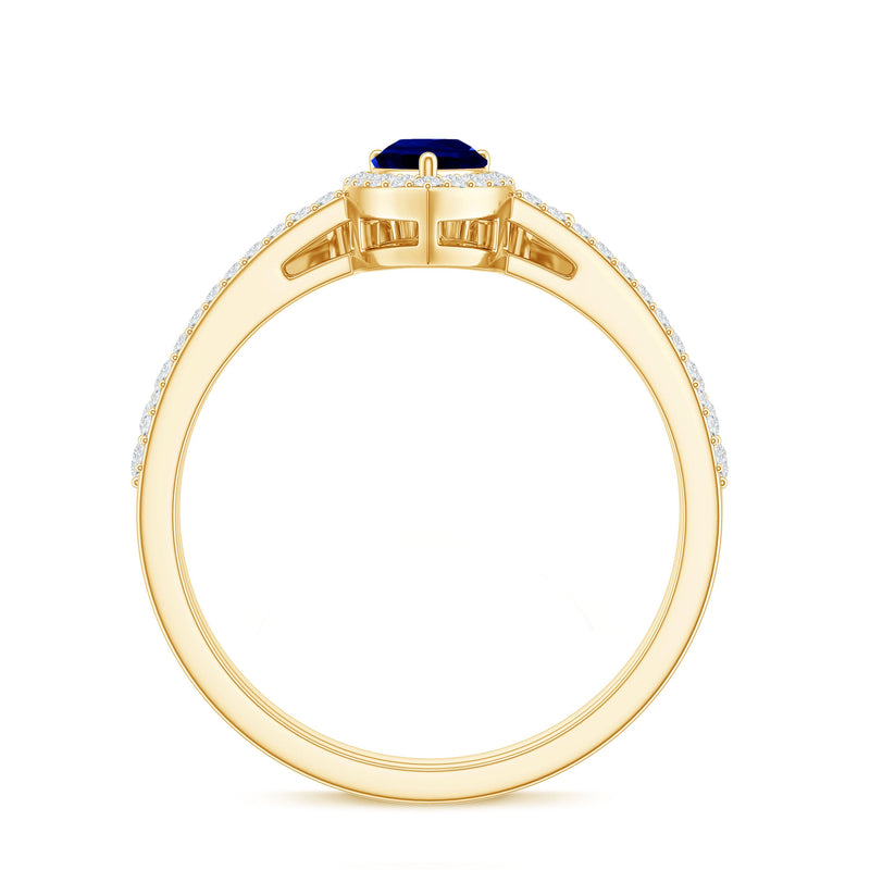 Pear-shaped blue sapphire and diamond engagement ring set by Rosec Jewels featuring lab-grown stones and intricate detailing.