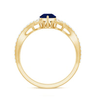 Pear-shaped blue sapphire engagement ring with diamond crossover setting by Rosec Jewels, showing the detailed design and sparkling gems.