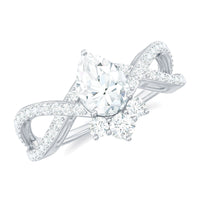 Pear-shaped moissanite crossover engagement ring by Rosec Jewels featuring a designer ring with sparkling stones and intricate band design.