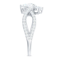 Pear-shaped moissanite crossover engagement ring by Rosec Jewels featuring a designer diamond ring with intricate band details