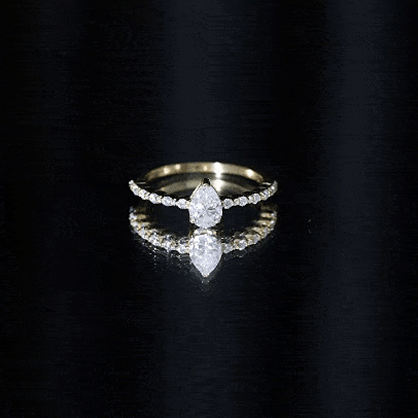 Yellow pear-shaped solitaire moissanite promise ring for women from Rosec Jewels, featuring a sparkling gemstone in a elegant ring setting.