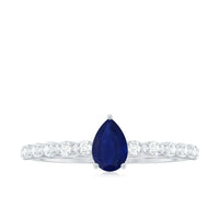 Minimal blue sapphire solitaire promise ring with diamond by Rosec Jewels, featuring a sleek design and a central blue sapphire gemstone.