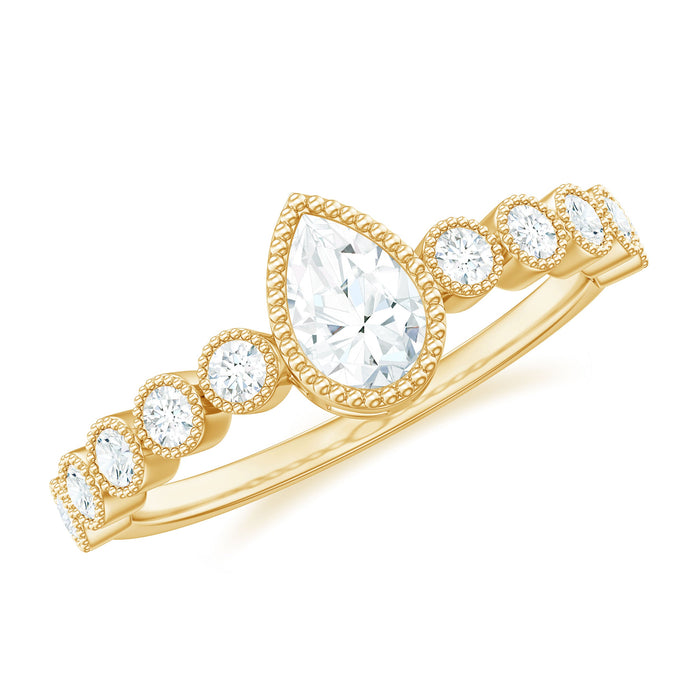 Beaded bezel set moissanite pear-shaped engagement ring by Rosec Jewels, featuring intricate beaded detailing and sparkling center stone.