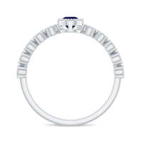 Pear cut 0.5 carat blue sapphire engagement ring with diamonds from Rosec Jewels, featuring a stunning gemstone and intricate band design.