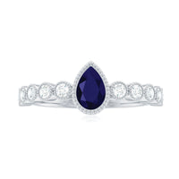 Pear cut 0.5 carat blue sapphire engagement ring with diamonds from Rosec Jewels, showcasing the elegant gemstone and sparkling accents.