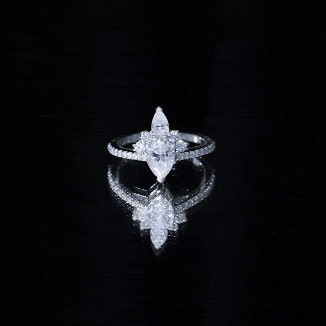 Pear-shaped 0.7 carat Moissanite engagement ring with a crown setting, featuring yellow gold band by Rosec Jewels.
