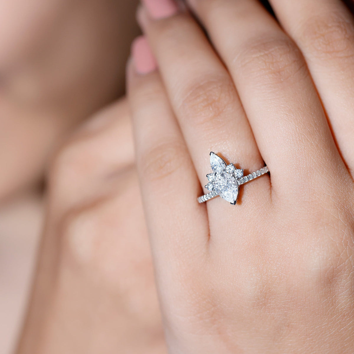 Pear-shaped 0.7 carat moissanite crown engagement ring by Rosec Jewels, showcasing a sparkling gemstone and intricate band details.
