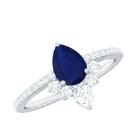 Pear-shaped blue sapphire engagement ring with 0.5 carat diamond accent, set in a Rosec Jewels ring design.