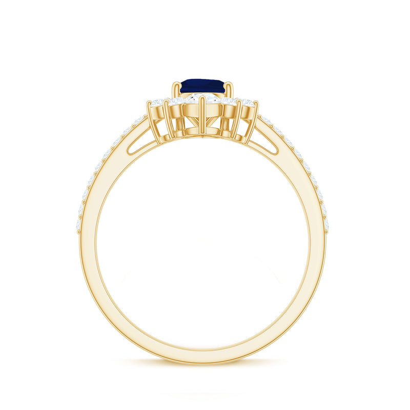 Pear-shaped blue sapphire engagement ring with diamond accents from Rosec Jewels, featuring a 0.5 carat certified gemstone and crown setting.
