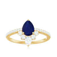 Pear-shaped blue sapphire crown engagement ring with diamonds from Rosec Jewels, featuring a 0.5 carat center stone and intricate design.